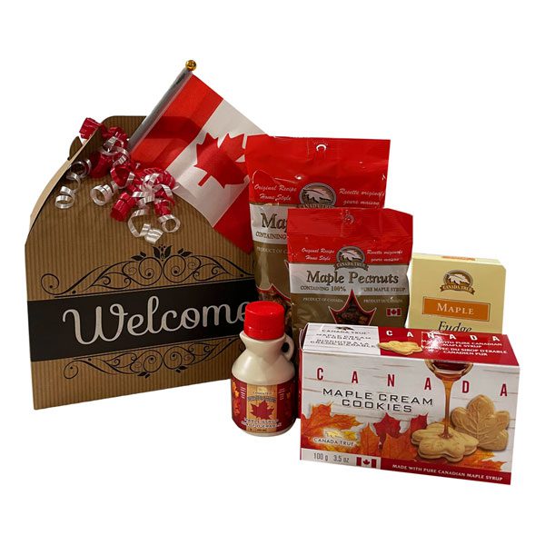 A Very Canadian Welcome Gift Pack-maple peanuts, maple popcorn, a large box of maple cream cookies, maple fudge, a Canadian flag and pure maple syrup.