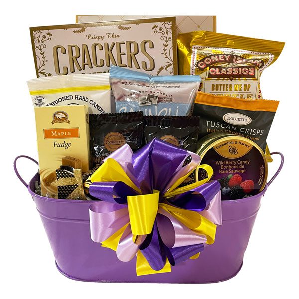 Busy Woman's Gift Basket filled with sweet and savory treats like shortbread, candy, popcorn, cannoli chips, fudge, cookies and more