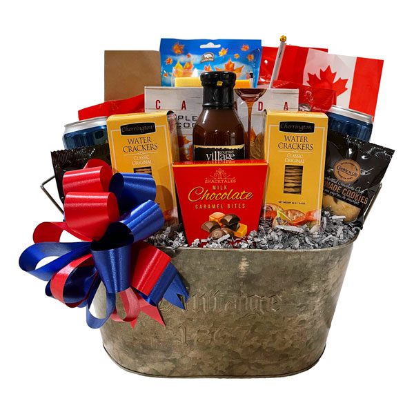 Canadian Kickback Gift Basket with moose droppings, maple candies, cookies, nuts, BBQ sauce, 2 cans of beer, crackers, cheeses, chocolates and shortbread