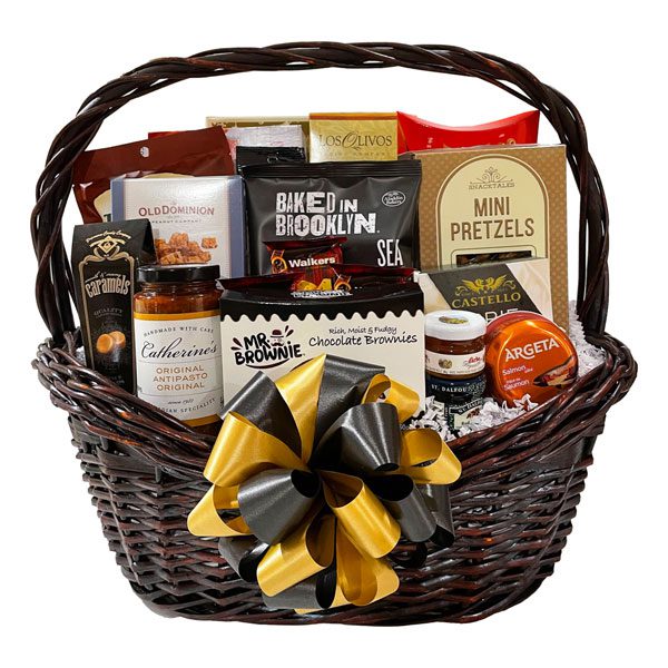 Executive Gift Basket with brie cheese, wine and cheese bisquits, pistachio nuts, pretzels, pita chips, peanut crunch, sugar cookies, brownies, maple cookies, smoked salmon, crackers, antipasto, caramels, salmon pate, honey, fruit spread, shortbread, old fashioned candies