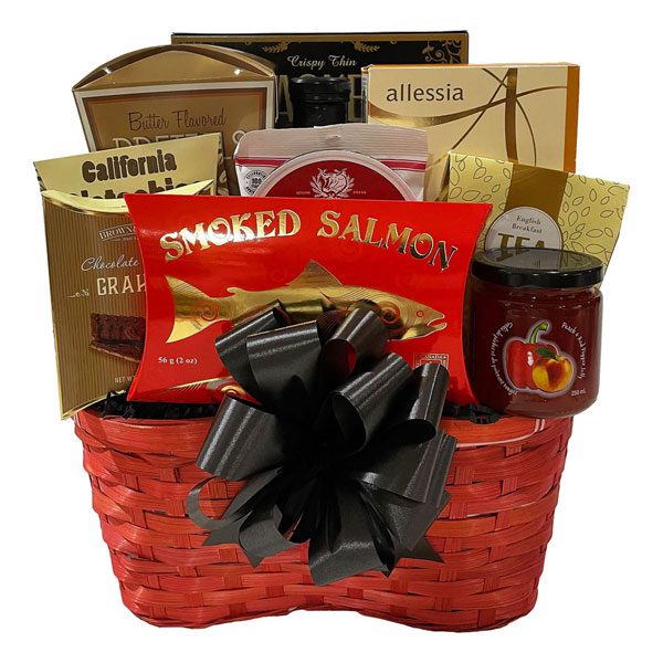 Gift Basket To Fall For-appetizer crackers, smoked salmon, Gourmet Du Village BBQ sauce, red pepper jelly, almond biscotti, pistachio nuts, old fashioned candies, tea, and chocolate grahams