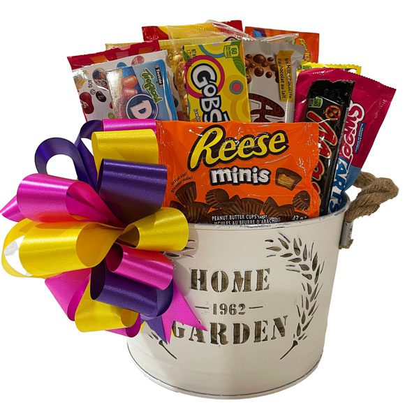 Good Ol Days Candy Basket with caramel popcorn, Razzles, a box of lemonade mix, Starburst Gummies, Swedish Berries, Gobstoppers, Chewy Sweetarts, Jelly Belly jelly beans, Skittles, Dots, an Aero bar, Reese's mini peanut butter cups and a Mars bar