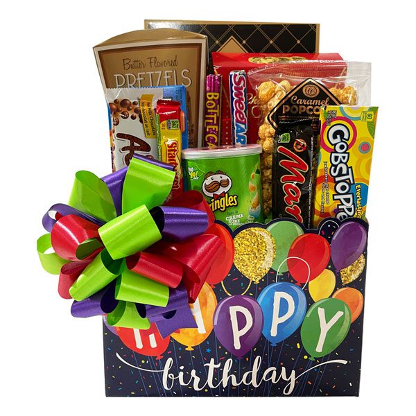 It's Your Birthday Gift Basket-an Aero chocolate bar, caramel popcorn, chocolate chip cookies, butter pretzels, Pringle's potato chips, a Mars chocolate bar, Gobstoppers, Aunt Gloria sugar cookies, theater size box of Mike & Ike, Starburst, Wonka Bottlecaps and Wonka Sweetarts