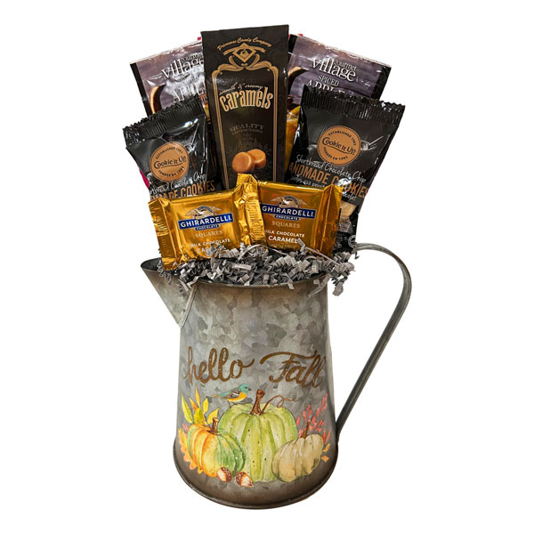 Memories of Fall metal pitcher with apple cider drinks, chocolate chip shortbread, chocolates and caramels.