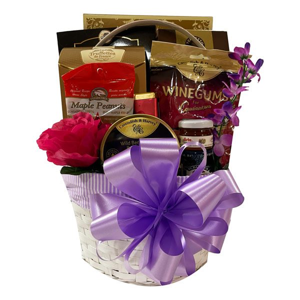 Rejuvenate with this gift basket filled with truffles, wine gums, Godiva, honey, jam, maple peanuts, crackers, candy and cookies