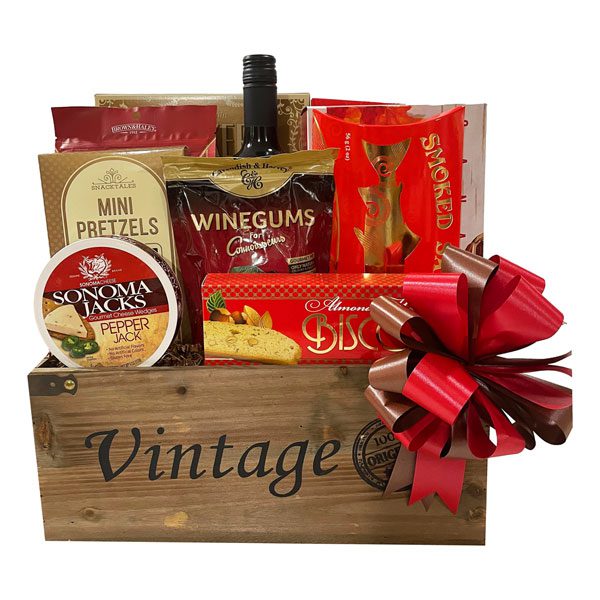 Wine Bistro Gift Basket with Pelee Island Merlot, biscotti, almond roca, maple cream cookies, pretzels, Pirouline chocolate wafers, smoked salmon, appetizer crackers, cheese and wine gums
