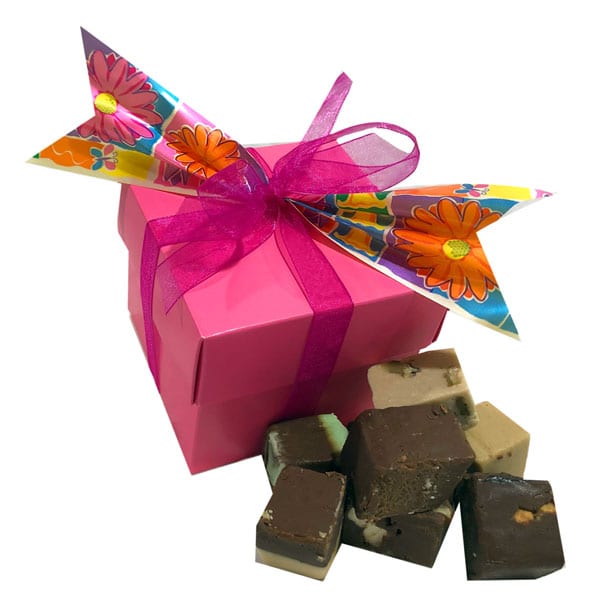 Fudge Sampler Gift Box holds a variety of fudge flavors in a beautiful pink gift box with ribbons and accents