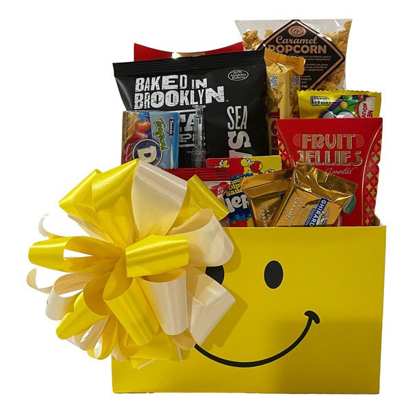 Get Well Soon Gift Basket with Jelly Belly jelly beans, Skittles, Nerds, a novelty Syringe pen, fruit jellies, Toblerone, Ghirardelli, Baked in Brooklyn bagel chips, Dots, caramel corn and chocolate chip cookies