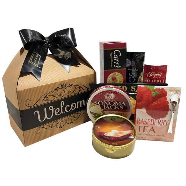 Welcome Gourmet Gift Pak with smoked salmon, pistachio nuts, raspberry tea, pepper/sesame crackers, butterscotch candies, cranberry trail mix and pepper jack cheese.