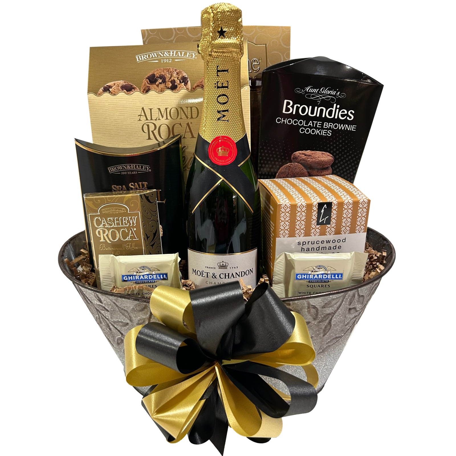 Champagne Tastes-a 375ml bottle of Moet and Chandon Champagne, Ghirardelli chocolates, sea salt and caramel roca, Sprucewood shortbread, cashew roca, Broundies brownie cookies, Pirouline wafers, and chocolate chip cookies.